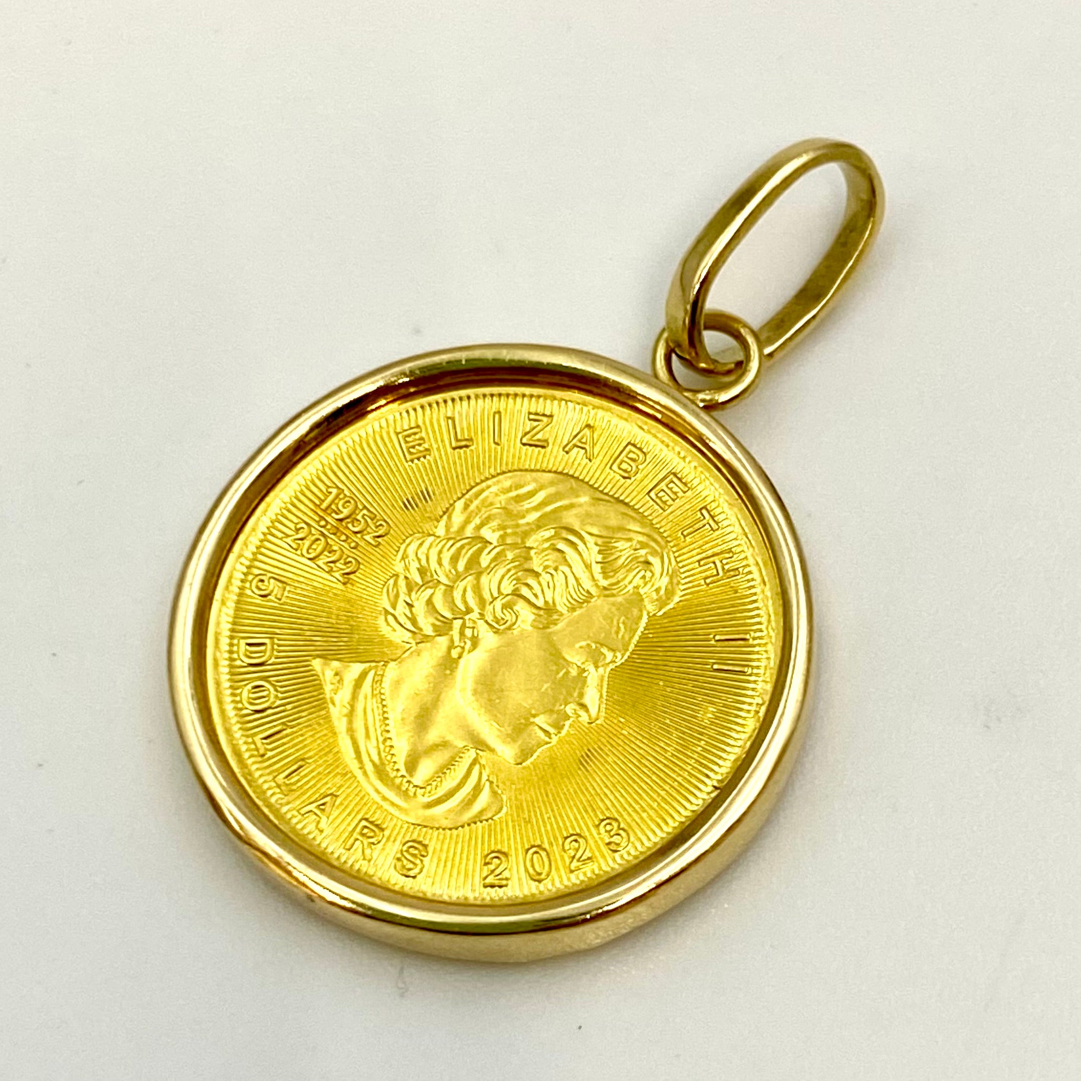 【送料無料】_ ノンブランド _メイプルリーフ金貨1/10oz_ペンダントトップ _枠K18/総重量4.1g _中古品