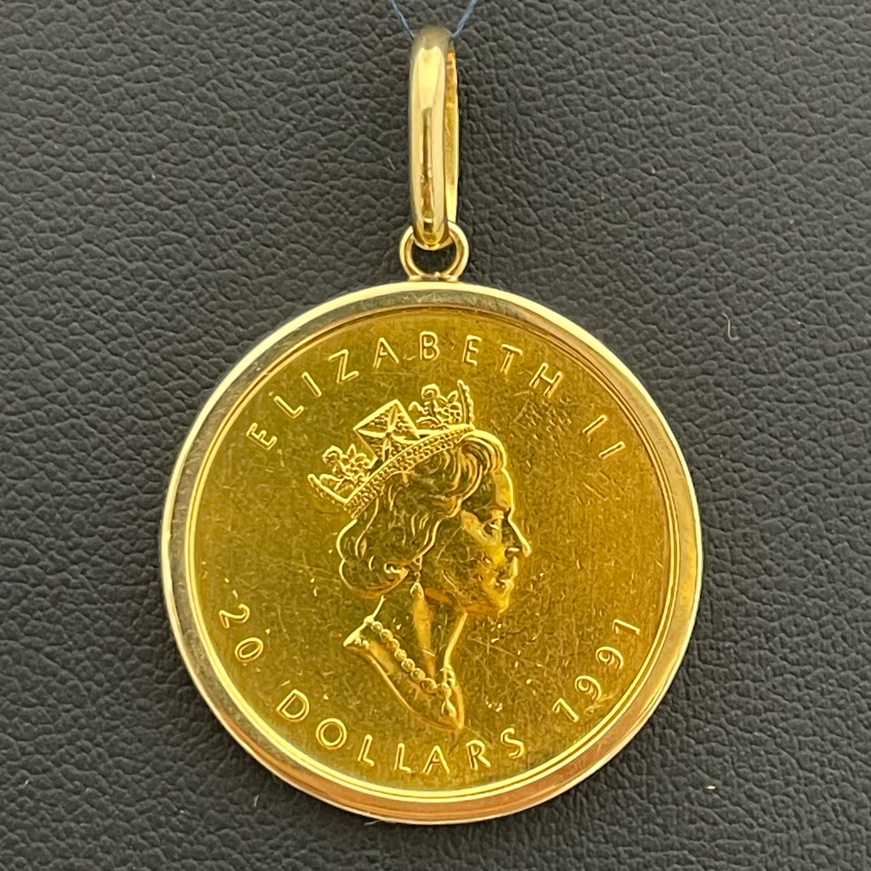 ノンブランド_ 純金コインペンダントトップ_ メイプルリーフ金貨1/2oz_ K18枠（総重量17.8g）_中古品
