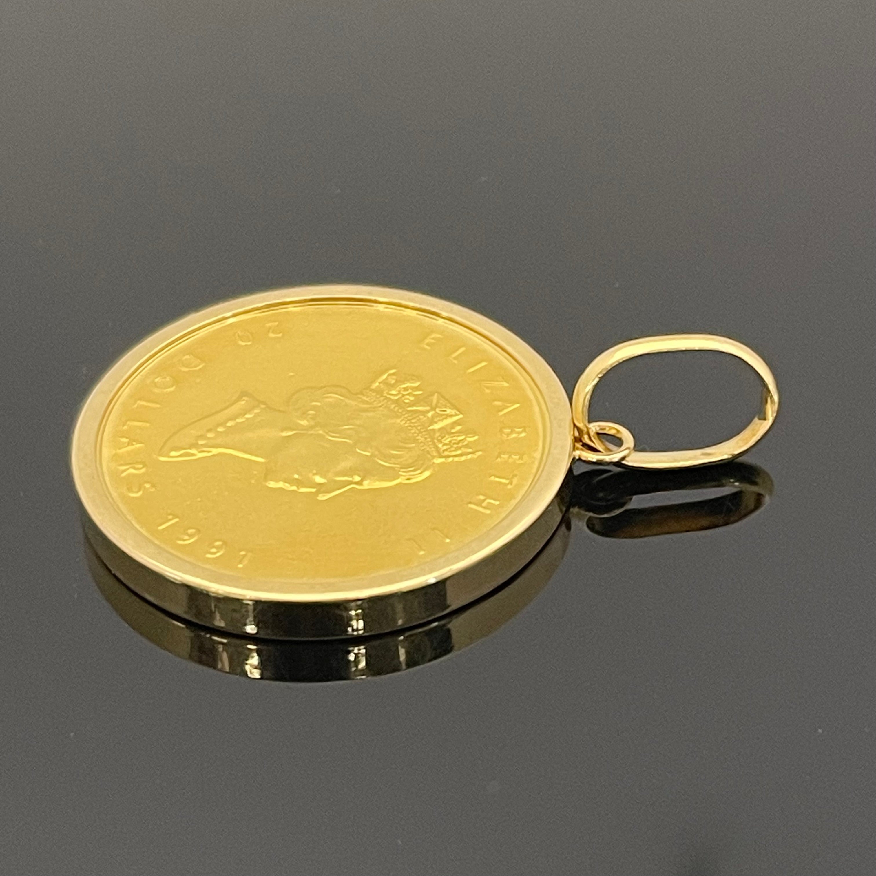 ノンブランド_ 純金コインペンダントトップ_ メイプルリーフ金貨1/2oz_ K18枠（総重量17.8g）_中古品