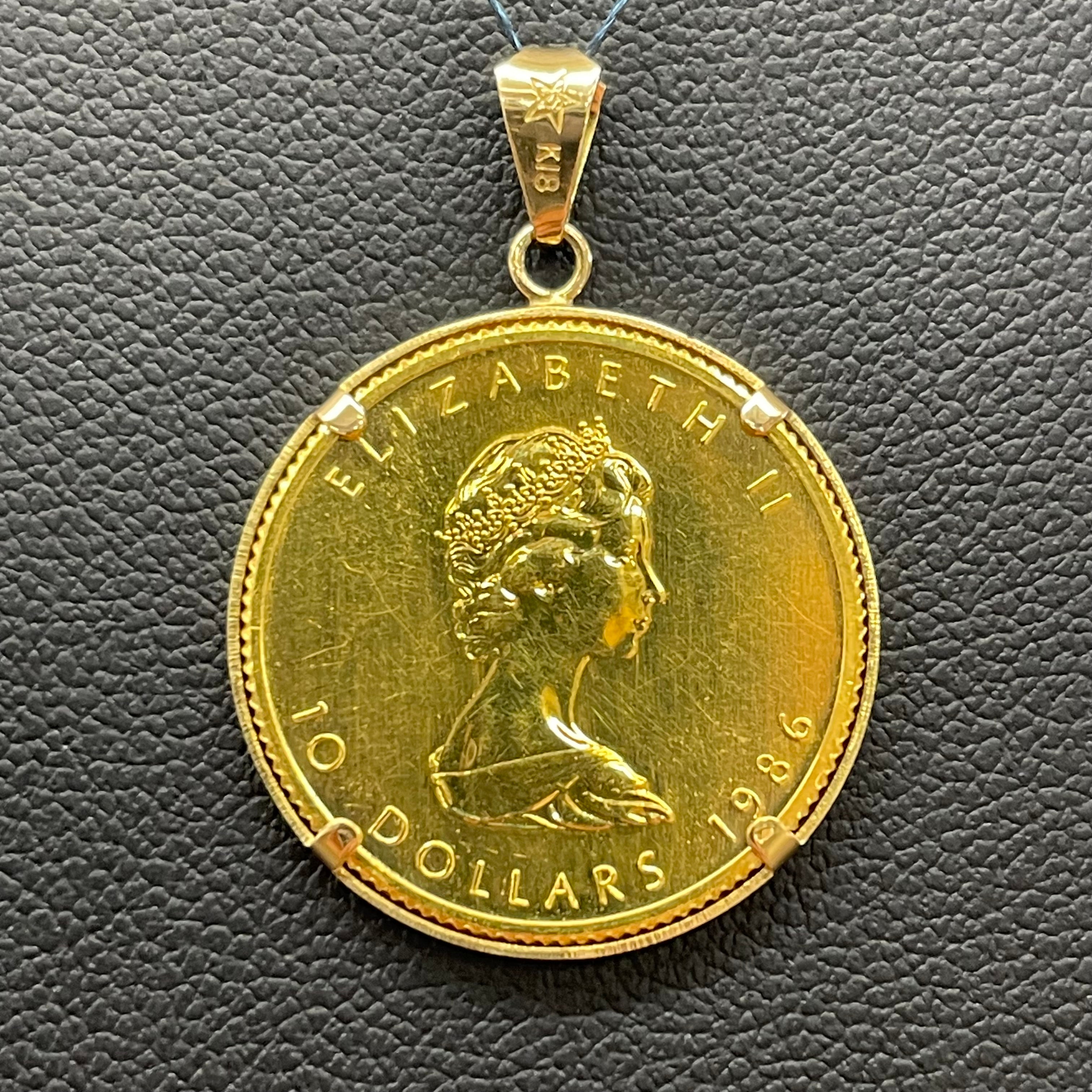 GINZA TANAKA_メイプルリーフ金貨1/4oz_ ペンダントトップ 8.8g_（純金コイン+K18）_中古品
